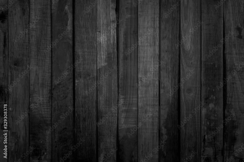 Fototapeta premium Ciemne drewno deski tekstura tło grunge. Vintage czarne drewniane deski ścienne antyczne pękanie w starym stylu obiekty tła do projektowania mebli. Malowana wyblakła dekoracja stołu z drewna liściastego.
