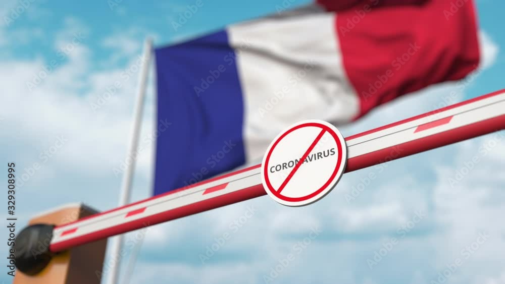 Barrier gate with STOP CORONAVIRUS sign being closed with flag of France as a background. French quarantine Barrier gate with STOP CORONAVIRUS sign being closed with flag of France as a background. French quarantine