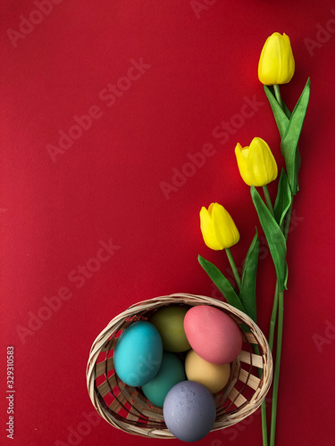 Template greeting card, copy Space for the feast of Easter, eggs colored with a red background
