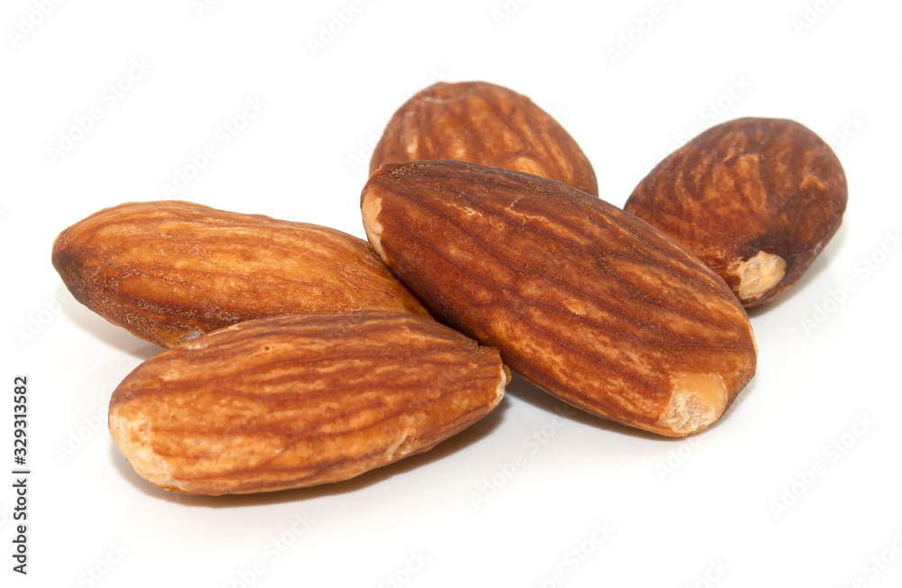 pile of almonds seeds isolated on white background pile of almonds seeds isolated on white background
