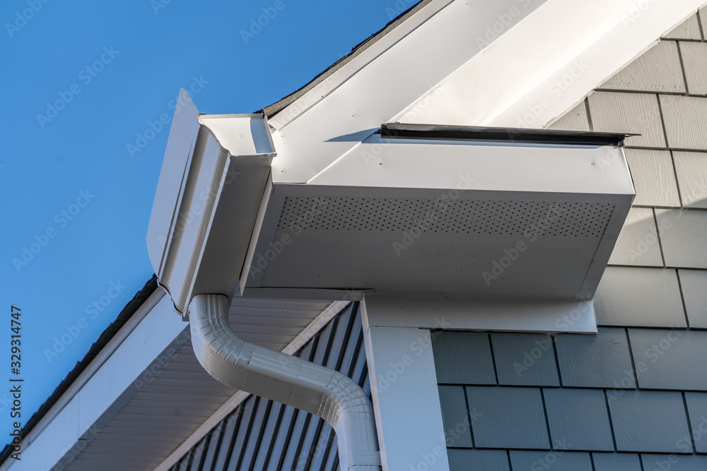Gutter system that collects water shedding off the roof, with slip