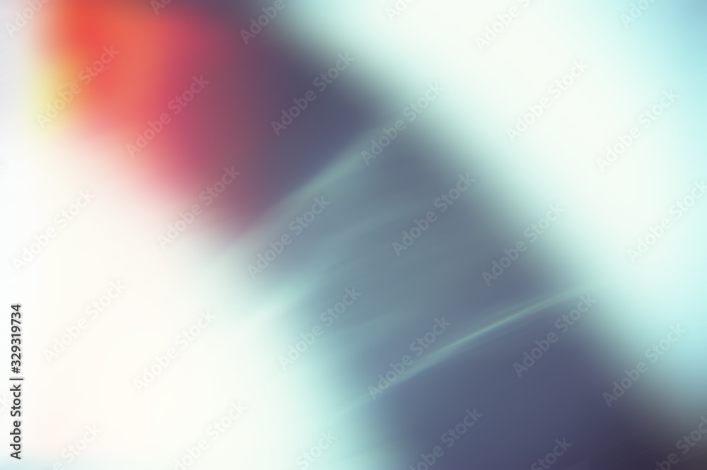 Abstract blurred light background with color dark spot.