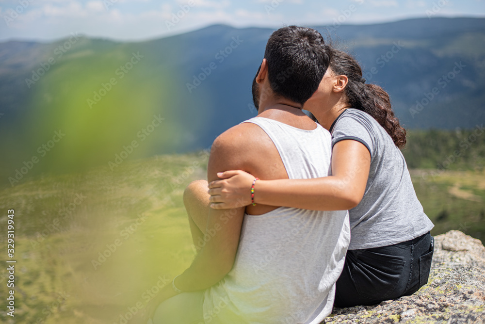 Young couple embracing in the mountain Young couple embracing in the mountain