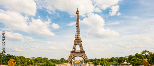 The Eiffel Tower in Paris on a beautiful summer day with bright sun