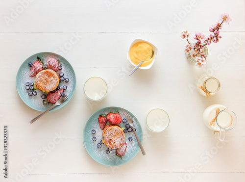 Mille Feuille, puff pastry discs with giant strawberries and blueberries with lemon curd. Gordon Ramsay recipe. Delicious French dessert with summer berries. photo