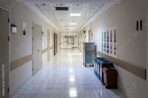 Empty hospital corridor. Health and medical concept © Tminaz