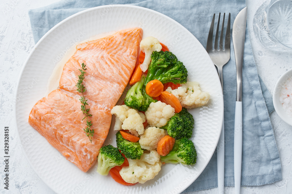 Steam salmon and vegetables, Paleo, keto, fodmap, dash diet. Mediterranean food with fish Steam salmon and vegetables, Paleo, keto, fodmap, dash diet. Mediterranean food with fish