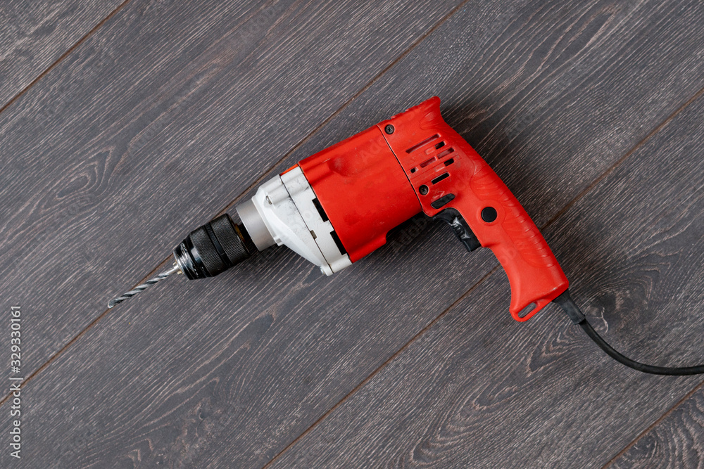 view from above of the simple single red drill work tool, copy space flat lay view from above of the simple single red drill work tool, copy space flat lay