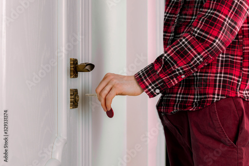close up person come home and open the door with the keys
