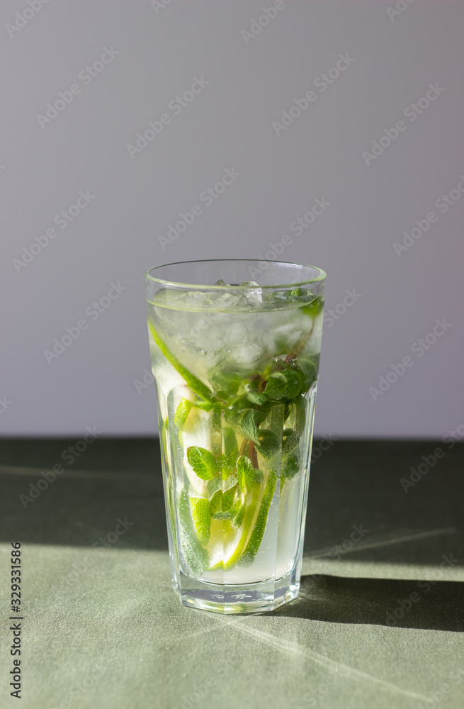 Cocktail mojito with lime, mint and ice. Recipe. Alcohol. Summer drink. Vegetarianism. Health. Cocktail mojito with lime, mint and ice. Recipe. Alcohol. Summer drink. Vegetarianism. Health.