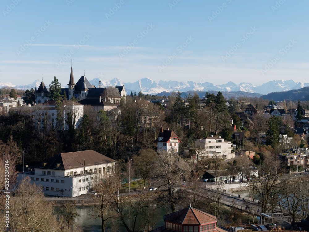Panoramic view of the south part of the city of Bern, Switzerland with the River Aare and Swiss Alps mountain range.