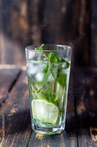 Cocktail mojito with lime, mint and ice. Recipe. Alcohol. Summer drink. Vegetarianism. Health.
