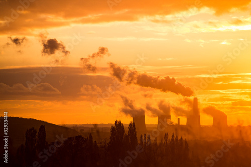 Coal power station silhouette at sunset emitting carbon UK. Fossil fuel pollution causing climate change. Climate emergency. Ratcliffe-on-Soar, Nottingham, Nottinghamshire, England, Untied Kingdom photo