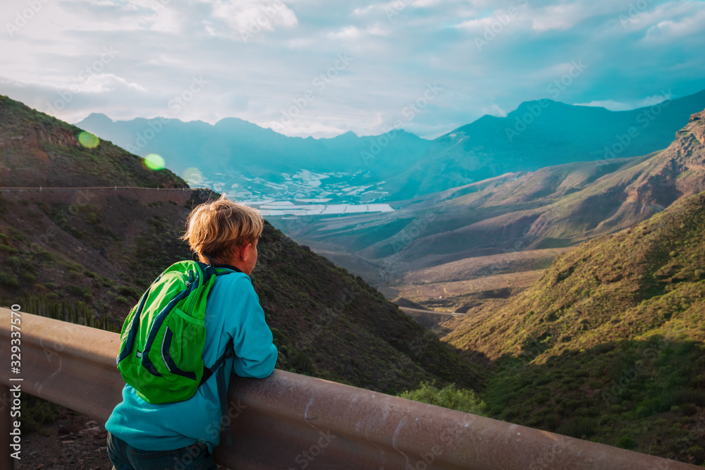 Fototapeta premium boy travel in mountains, kids looking at scenic view