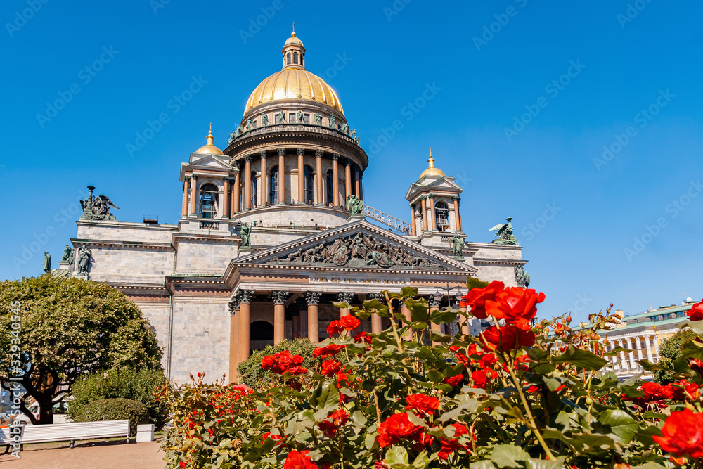 View of St. Isaac's Cathedral in St. Petersburg with red roses in front of it