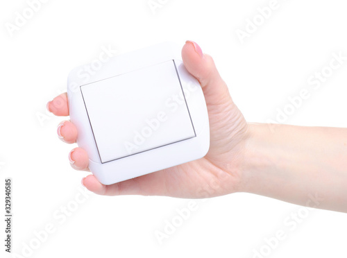 electric switch button in hand on white background isolation photo