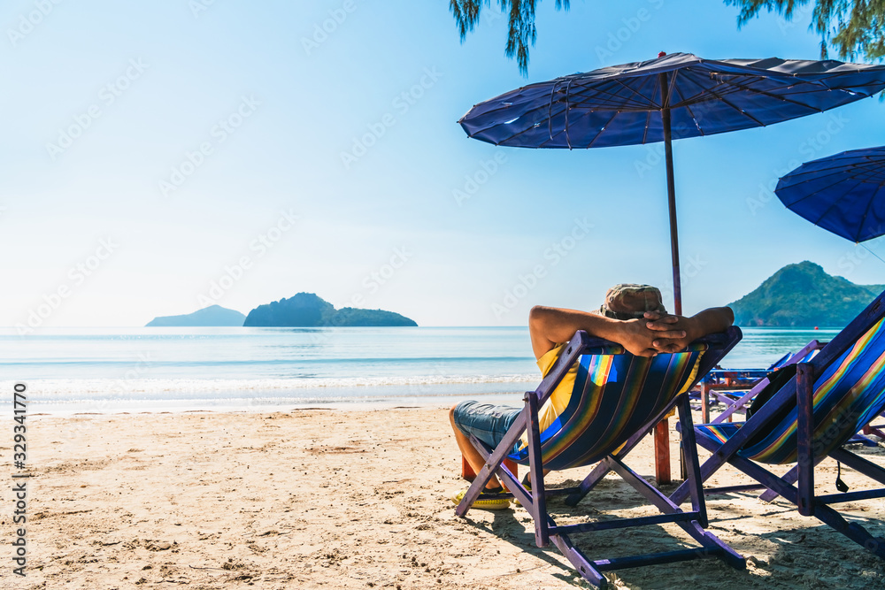Summer lifestyle Asian man traveler relaxing on beach chair in front of vacation exotic beach, Attraction place leisure tourist travel Hua Hin Thailand holiday trip, Tourism beautiful destination Asia Summer lifestyle Asian man traveler relaxing on beach chair in front of vacation exotic beach, Attraction place leisure tourist travel Hua Hin Thailand holiday trip, Tourism beautiful destination Asia