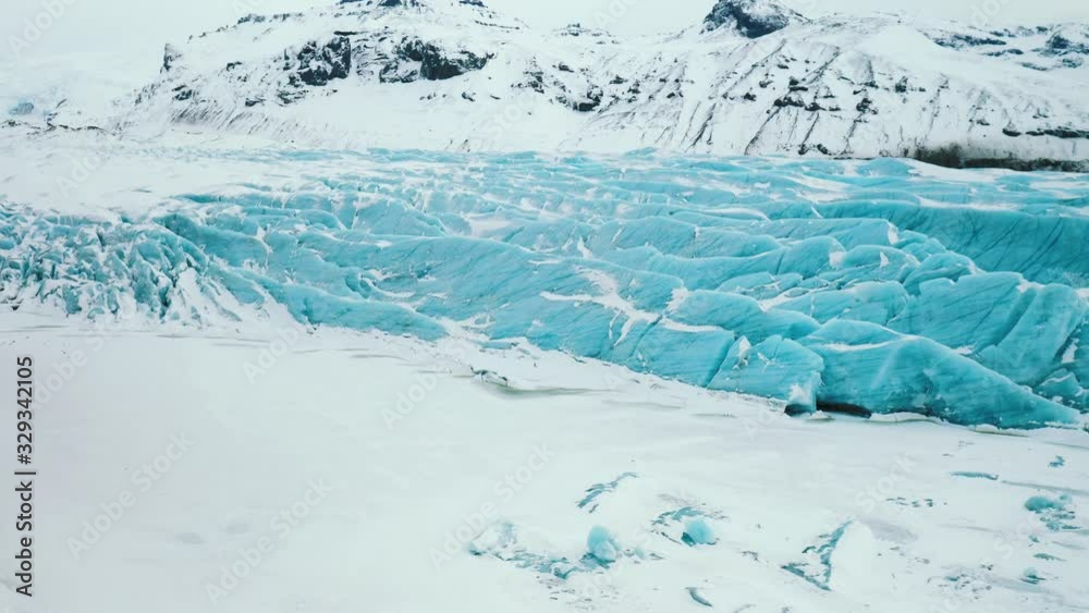 Aerial drone shot of huge glacier in Iceland. Aerial view of Vatnajokull Icelandic glacier in the mountains Aerial drone shot of huge glacier in Iceland. Aerial view of Vatnajokull Icelandic glacier in the mountains