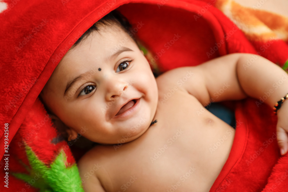 Cute indian little boy playing on bed Cute indian little boy playing on bed