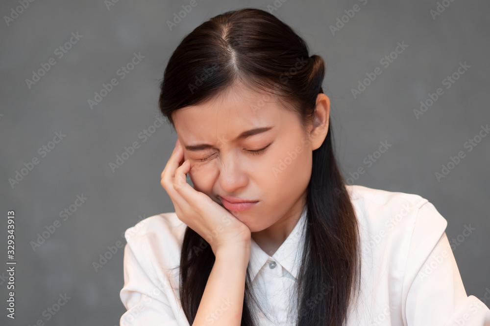 woman with toothache; sick asian woman suffering from toothache, tooth decay, tooth sensitivity, wisdom tooth pain, cavity, dental care concept; young adult asian woman model woman with toothache; sick asian woman suffering from toothache, tooth decay, tooth sensitivity, wisdom tooth pain, cavity, dental care concept; young adult asian woman model