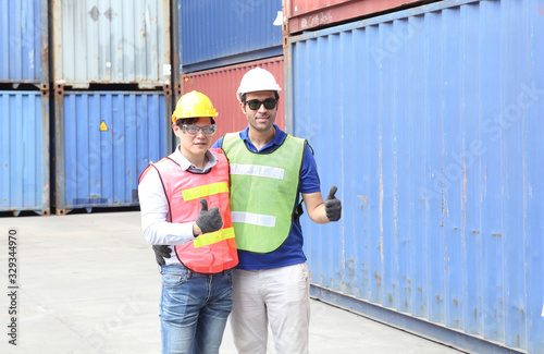 Engineering group working and they are loading container for support logistics and import export business