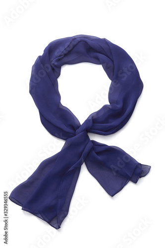 Subject shot of a navy blue scarf made of semi-transparent viscose fabric. The tied scarf is isolated on the white background. 