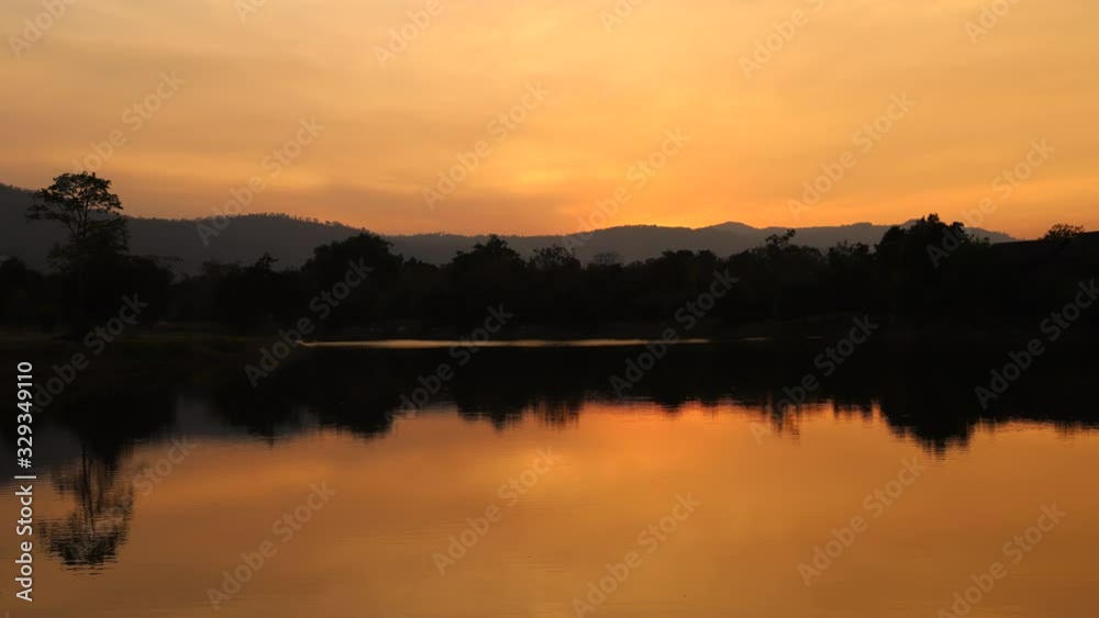 Timelapse of sunset at evening time with the mountain and lake view Timelapse of sunset at evening time with the mountain and lake view