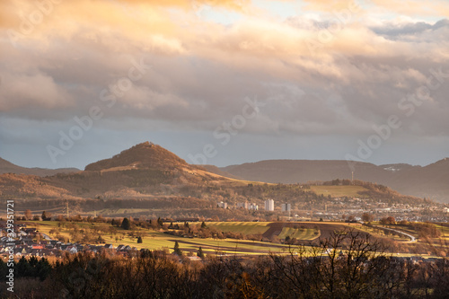 Panoramablick auf die Reutlinger Alb bei Sonnenuntergang mit Wolken photo