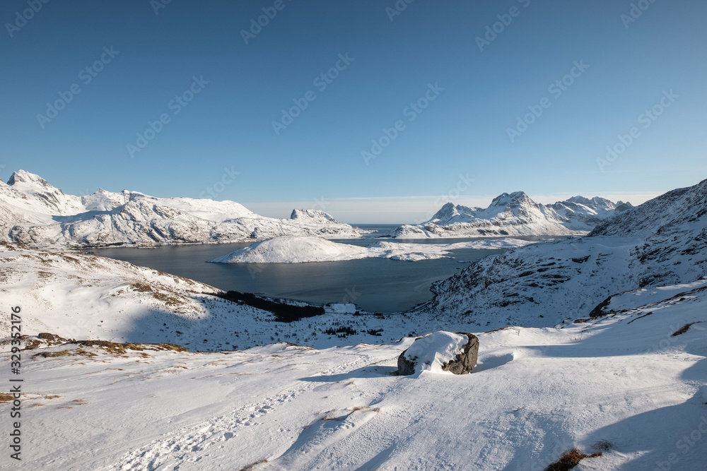 Snowy hill with blue sky on winter at Lofoten islands, Norway