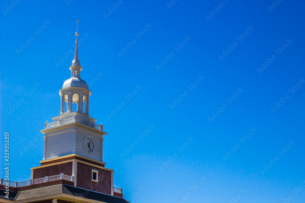 White Clock Tower Atop Brick Building White Clock Tower Atop Brick Building