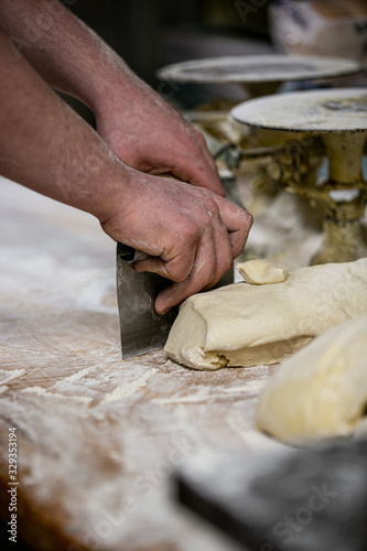 baker cutting dough