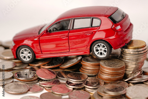 Car on coins background : Car loan, Finance, saving money, insurance and leasing time concepts.