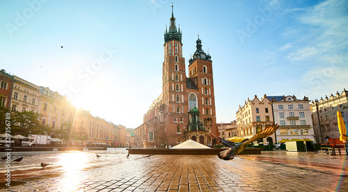 St. Mary's Basilica on the Krakow Main Square (Rynek Glowny) during the sunrise, Poland photo