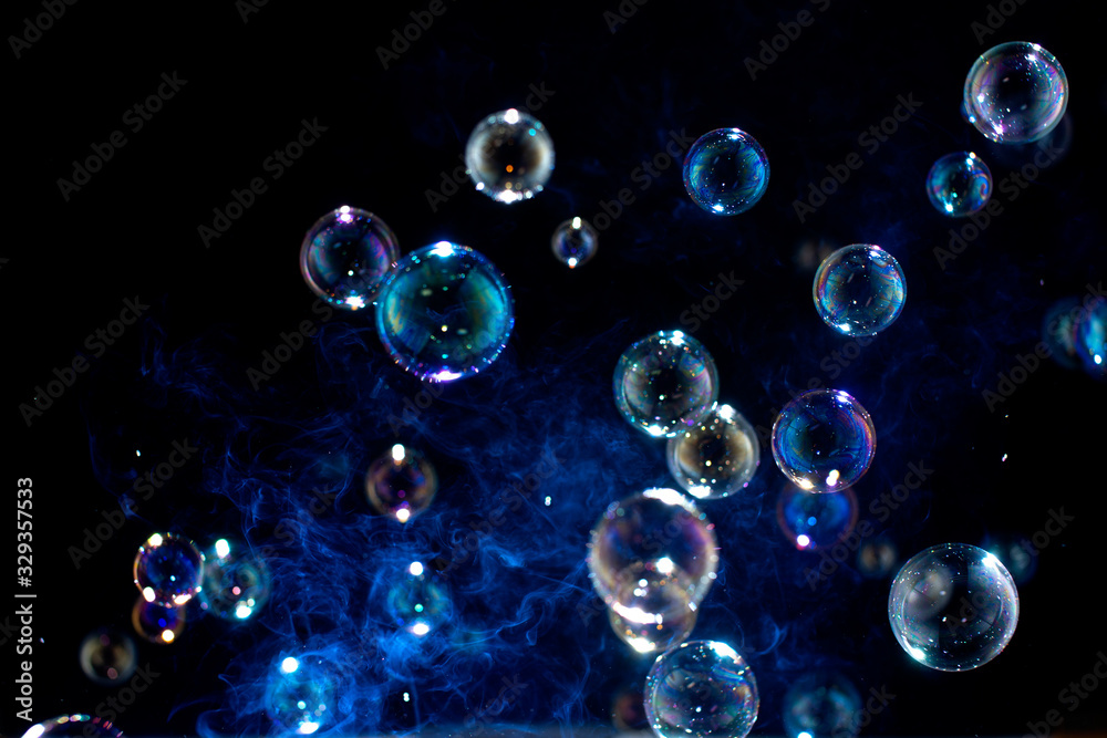 Blurred of Bubble on black background, Bokeh with background.