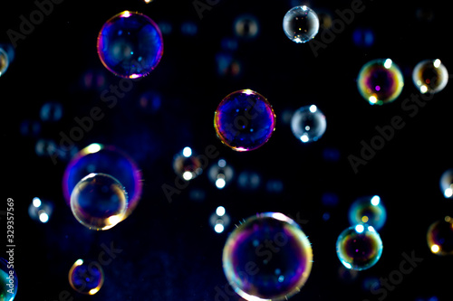 Blurred of Bubble on black background, Bokeh with background.