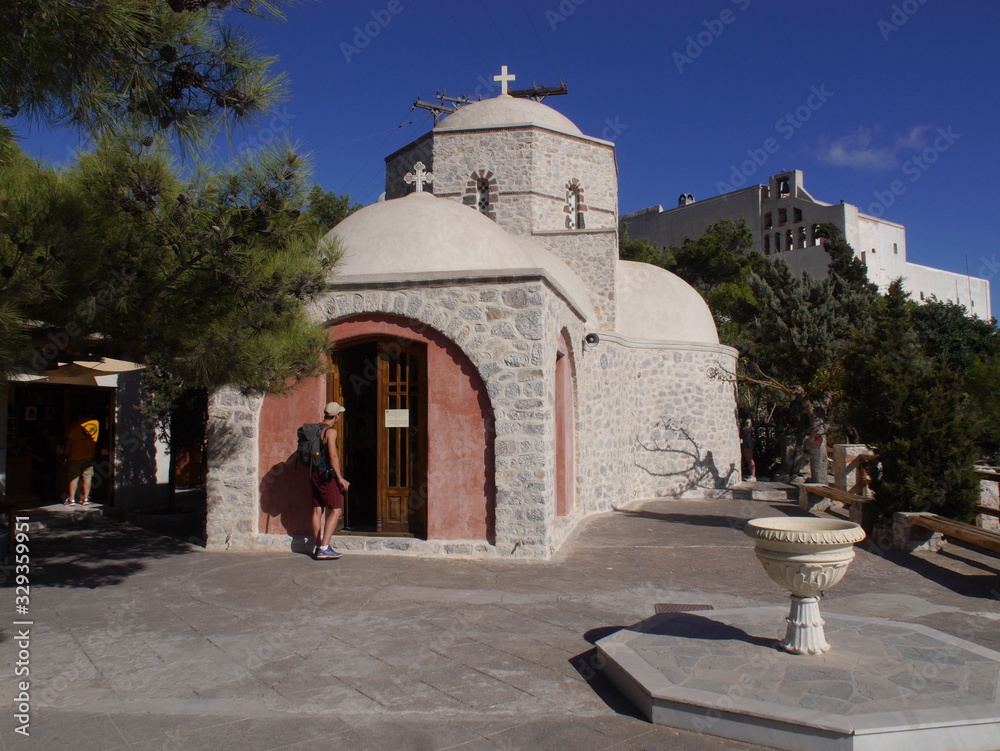 Fototapeta premium Details of the exteriors and interiors of the Orthodox monastery of the prophet Elijah located on the mountain of the prophet Elijah on the island of Santorini, Greece.