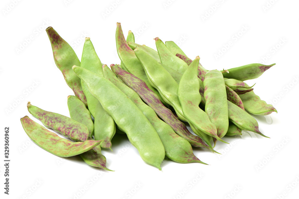 Red and green string beans on white background