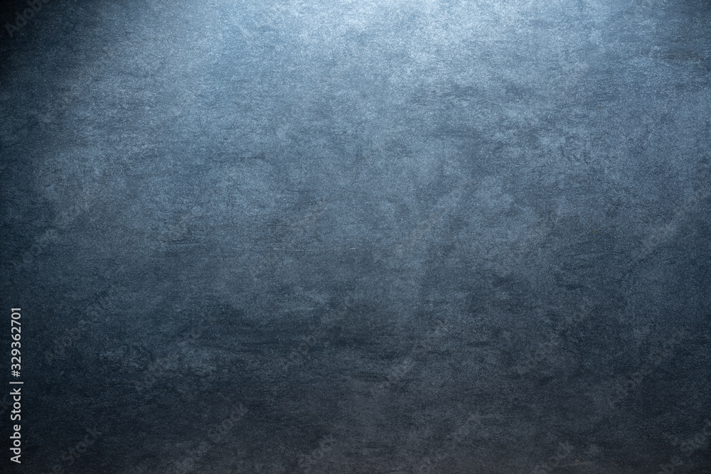 cold colored grunge stone background texture with radial gradient and copy space