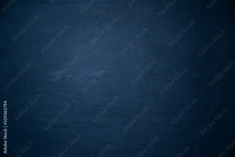smooth old concrete background texture blue colored with radial gradient and copy space