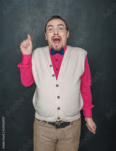 Surprised Funny teacher or business man on blackboard