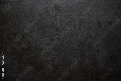 black grunge concrete stone background texture with light gradient and copy space