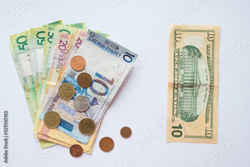 Belarusian money and dollar bills for financial and investment concepts.