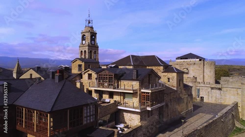 Puebla de Sanabria Castle on beautiful day. Aerial descending photo