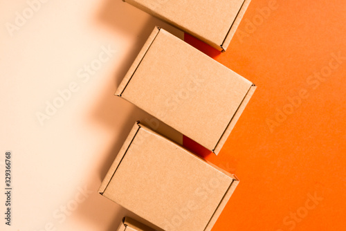 Set of brown cardboard boxes on colorful background