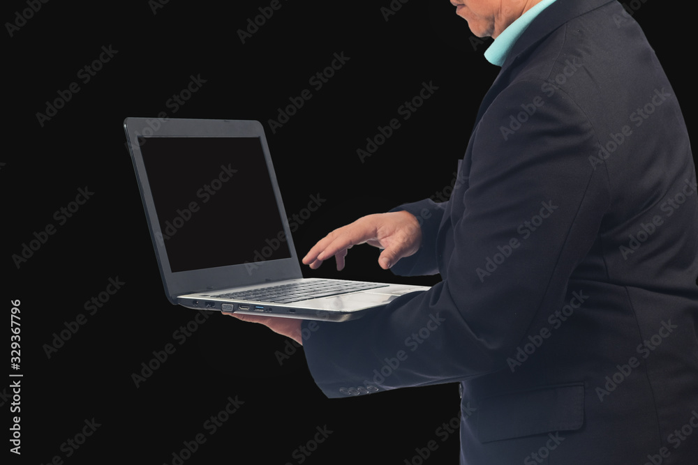 Businessman hold laptop to work on black background. Businessman hold laptop to work on black background.