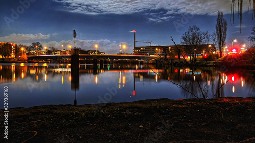 Berlin skyline with Spree river at night with reflexions