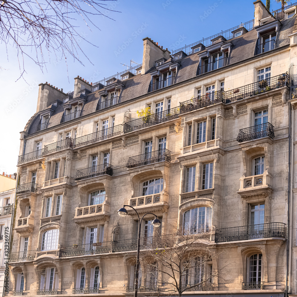 Paris, typical facade and windows, beautiful building boulevard Richard-Lenoir
