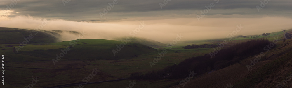 Stunning cloud inversion panorama in the Peak District National Park during sunrise