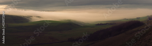 Stunning cloud inversion panorama in the Peak District National Park during sunrise
