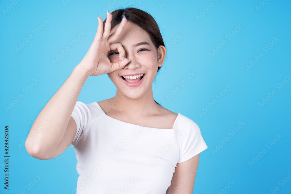 Asian women that look bright, Isolated on blue, Asian woman. Asian women that look bright, Isolated on blue, Asian woman.